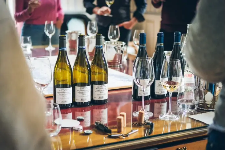 Bottles and glasses on a table in Beaune, France. 